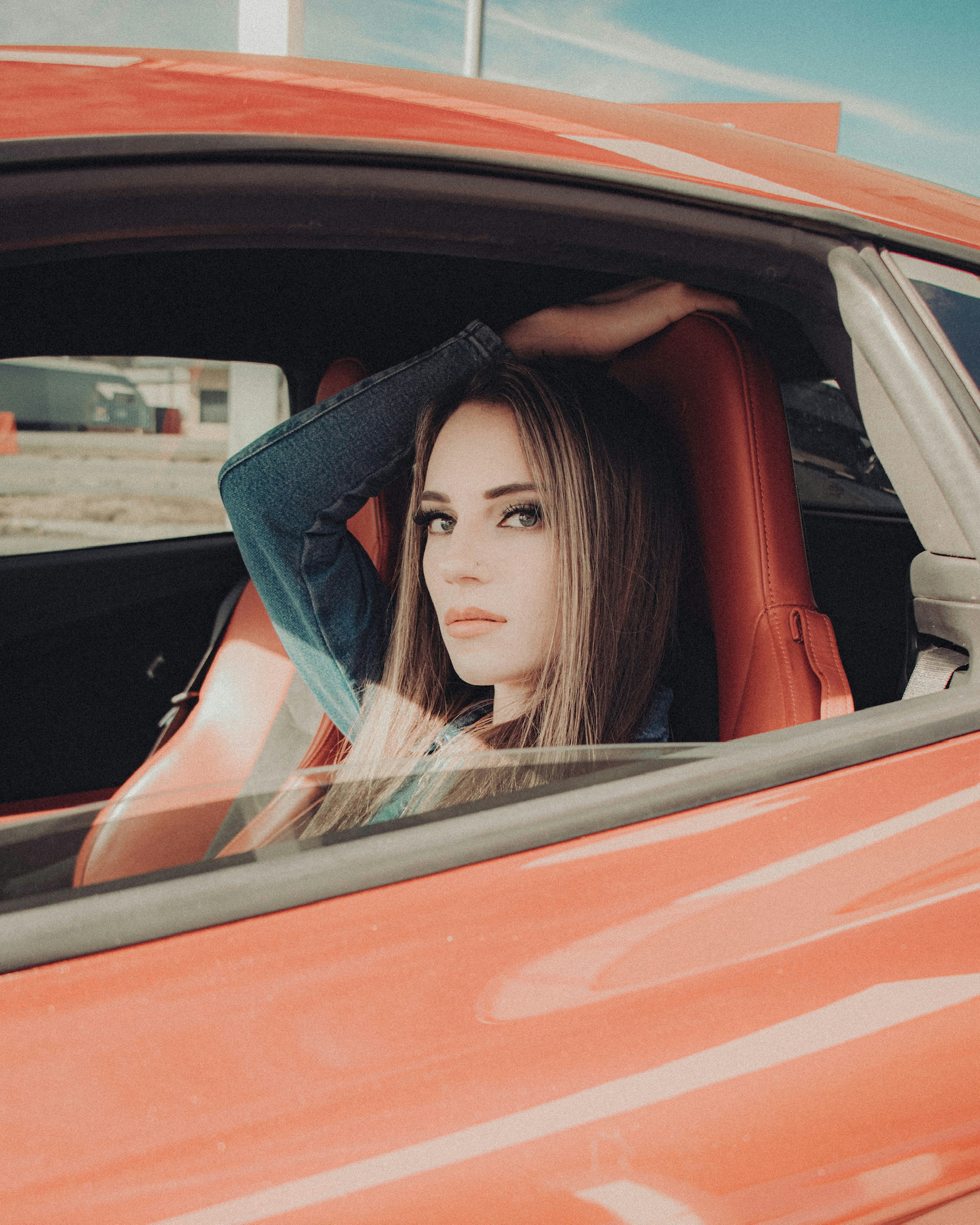 woman in black long sleeve shirt sitting inside car during daytime